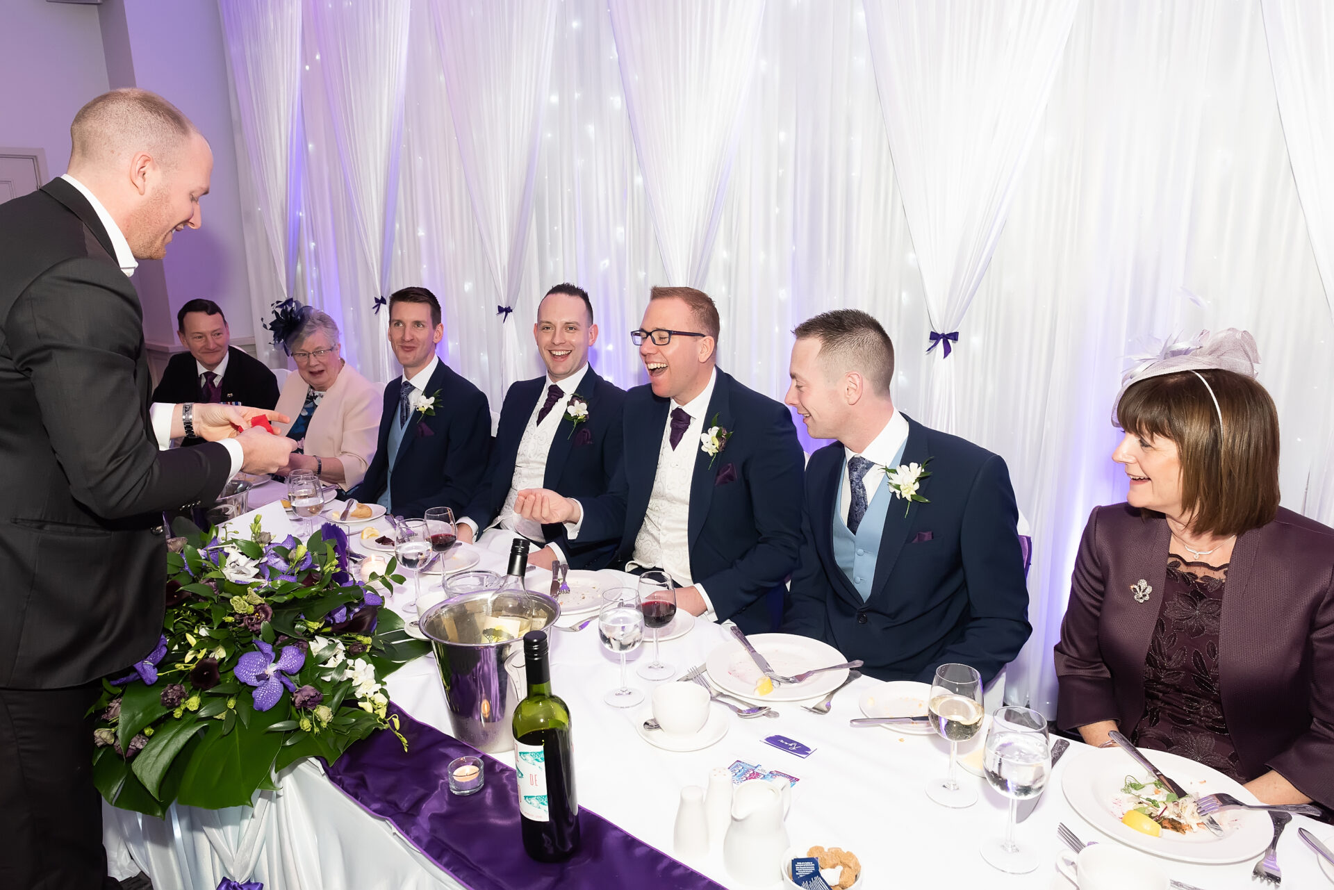 wedding-breakfast-magician magician performing at the top table during a wedding breakfast